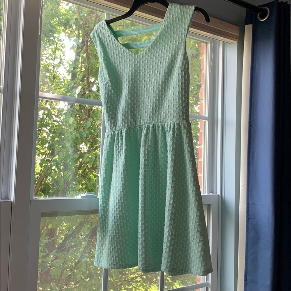 Mint green patterned skater dress with cutouts